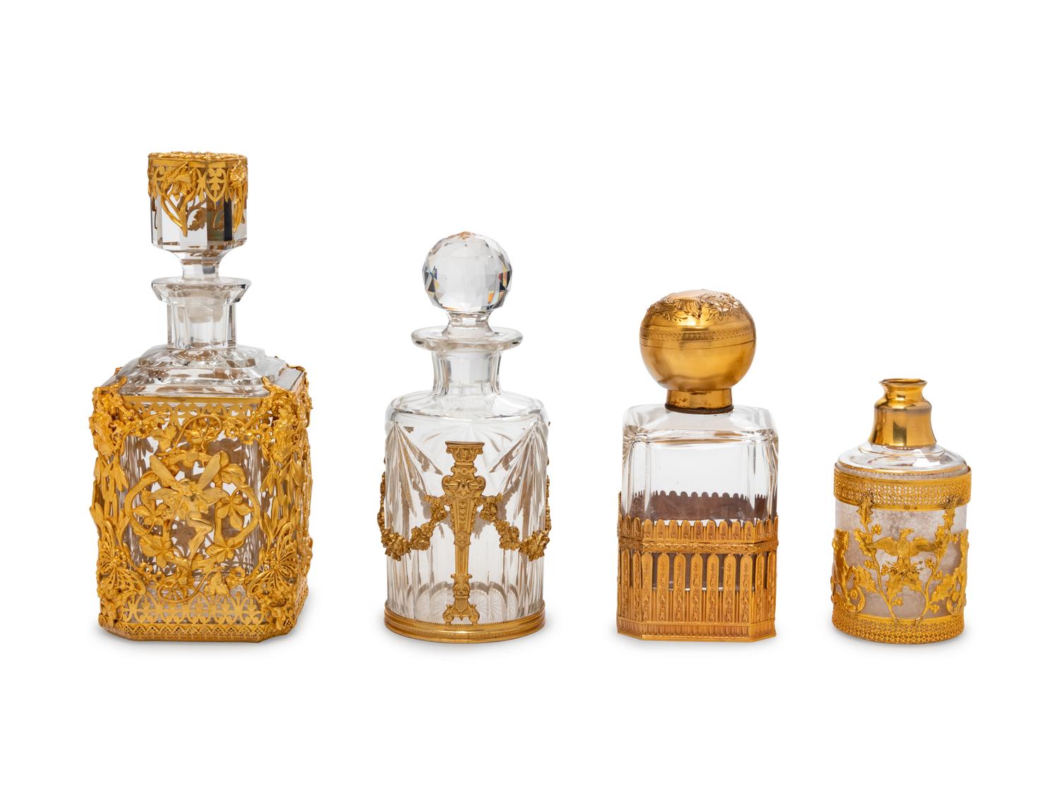 Four French Gilt Bronze Mounted Glass Bottles