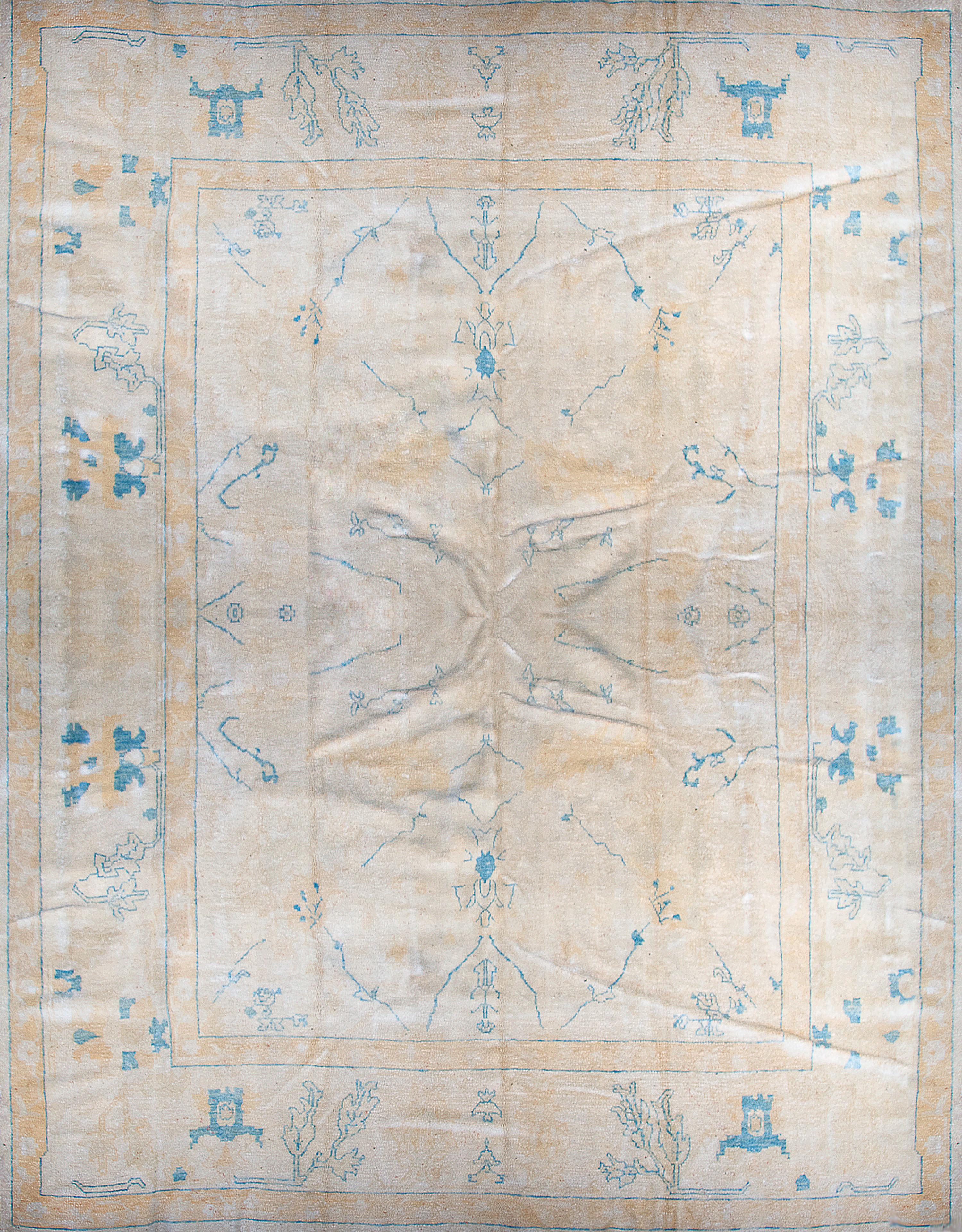 An Oushak Rug. 10 feet x 13 feet 7 inches.