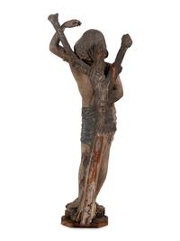 An Italian Carved and Polychromed Figure of St. Sebastian Tied to the Tree