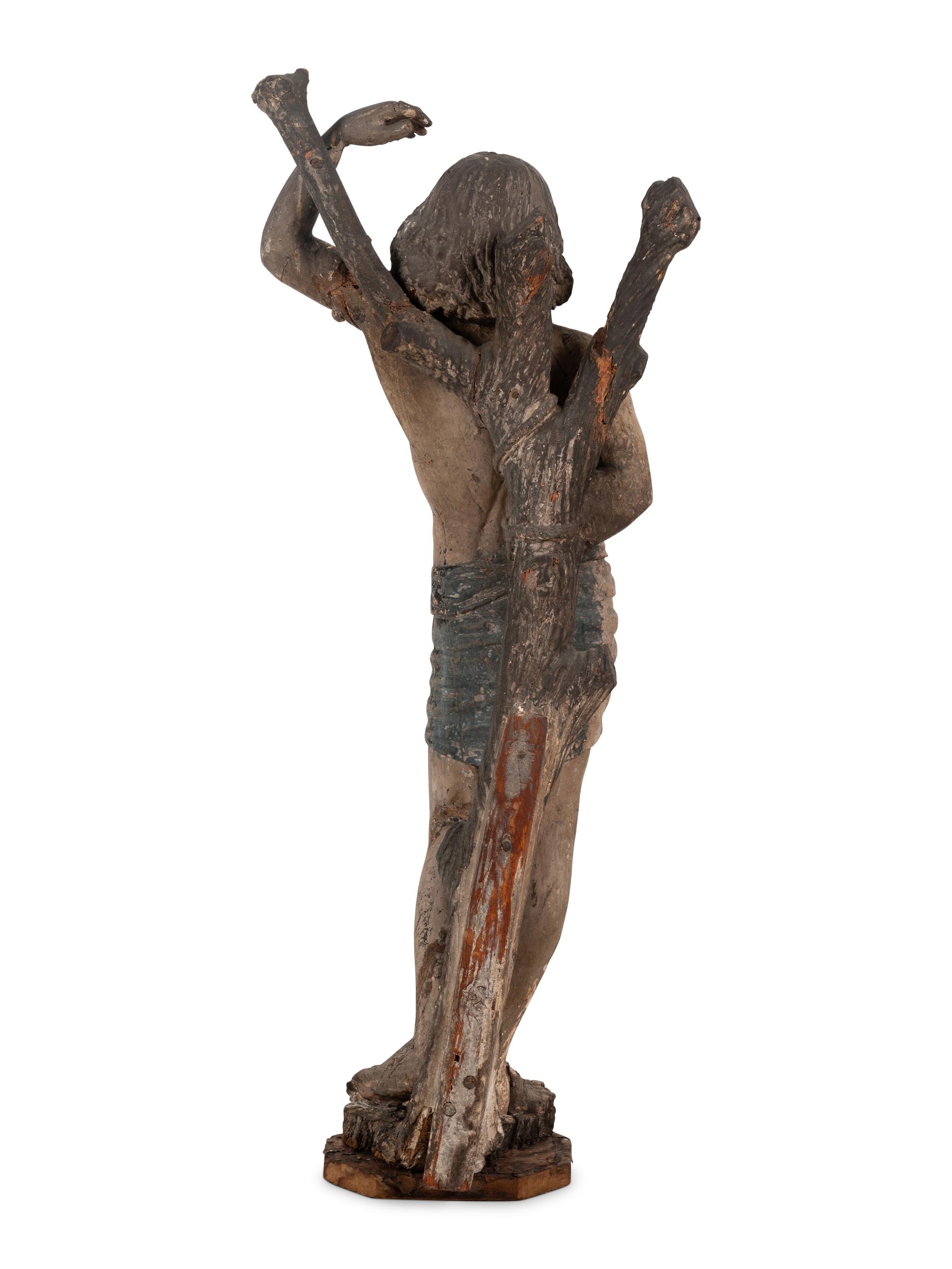 An Italian Carved and Polychromed Figure of St. Sebastian Tied to the Tree