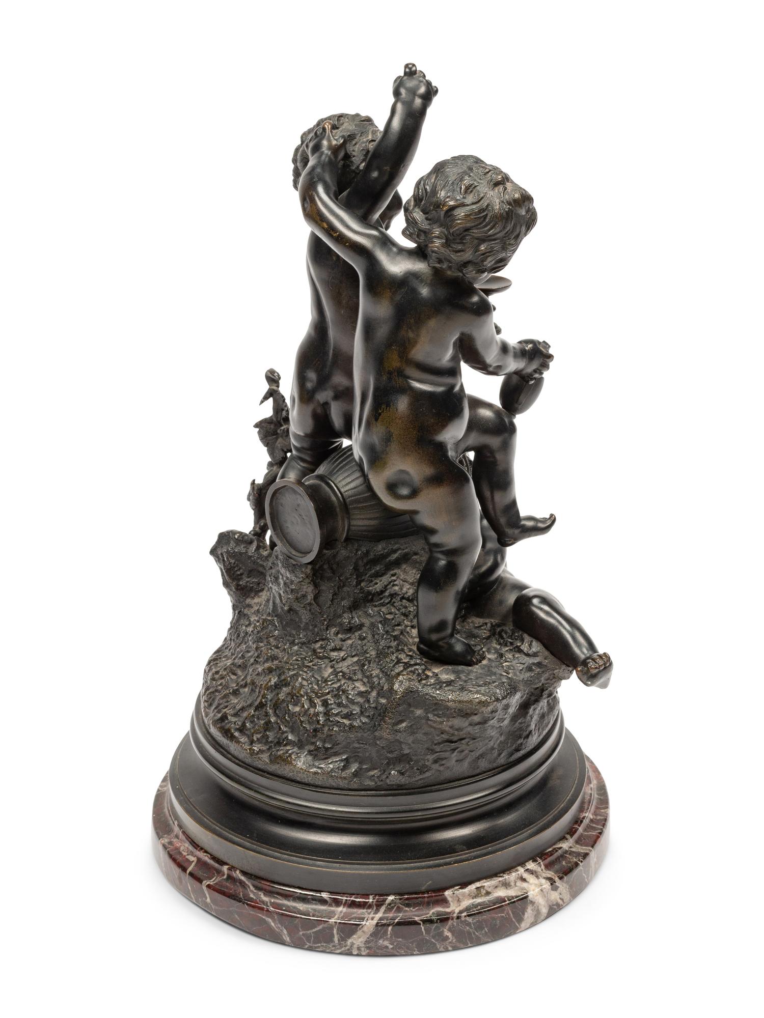 A Continental Patinated Bronze Figural Group After Claude Michel (Clodion)