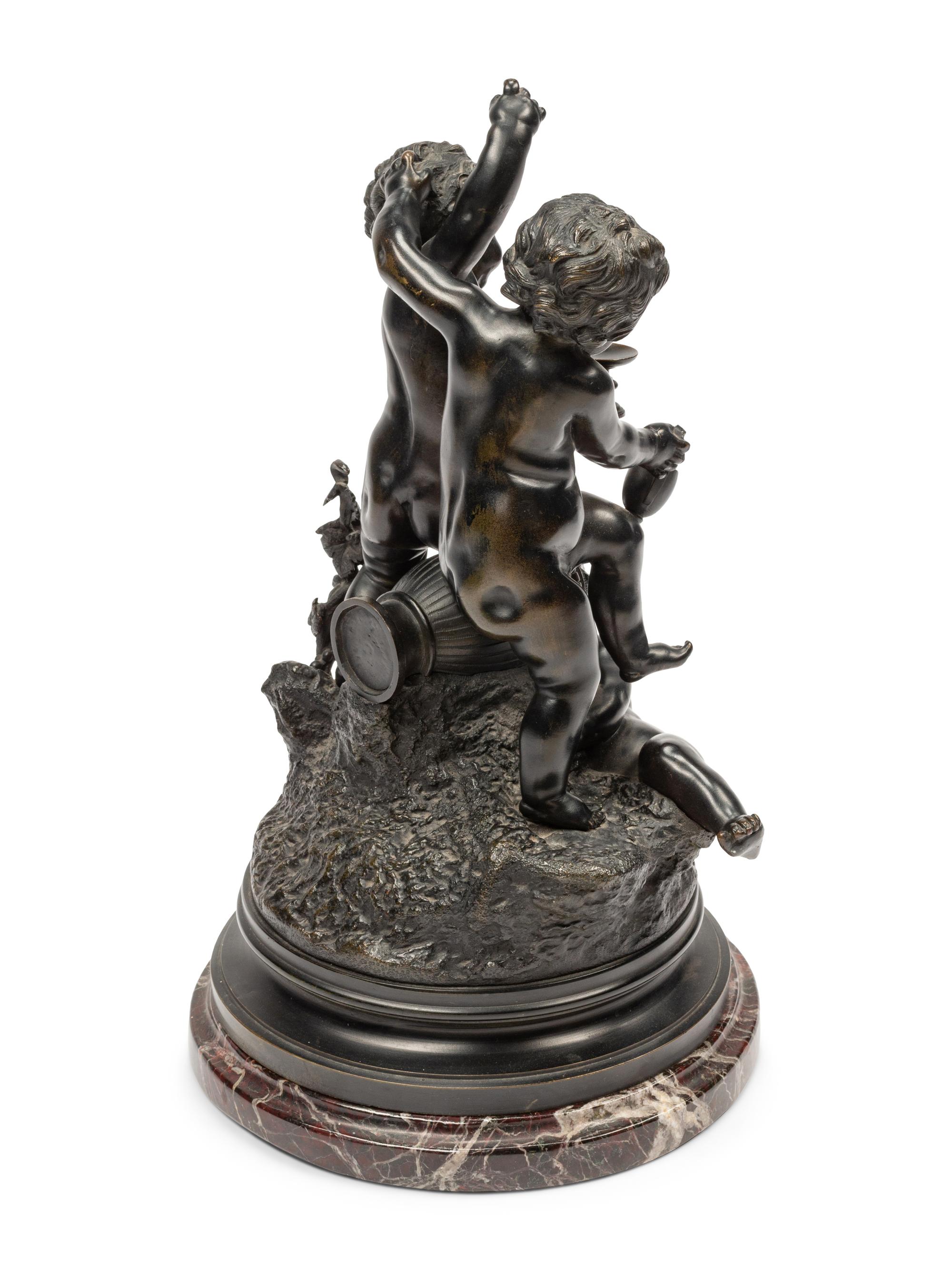 A Continental Patinated Bronze Figural Group After Claude Michel (Clodion)
