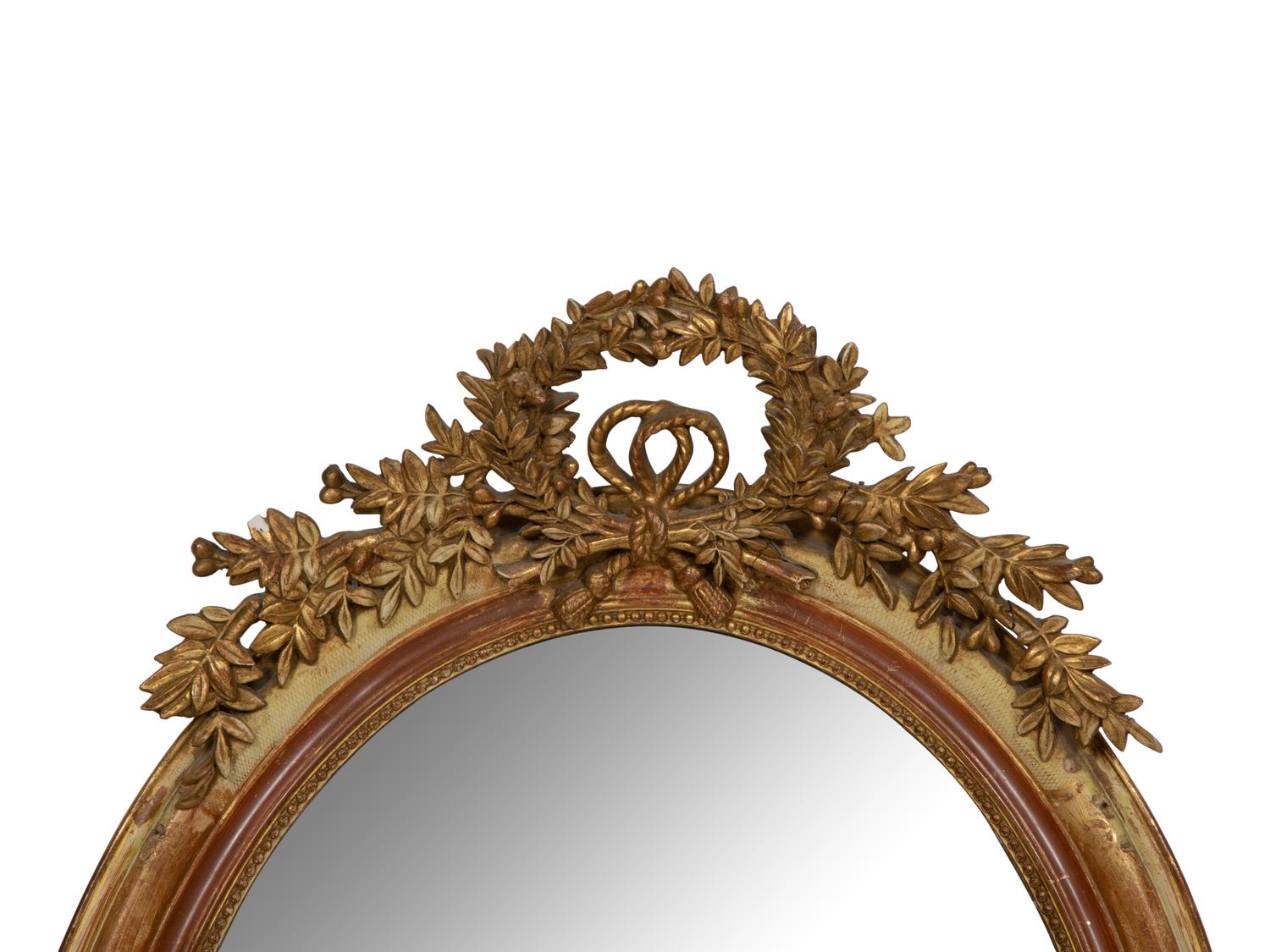 A Napoleon III Giltwood Oval Mirror