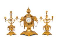 An English Orientalist Gilt Bronze Three-Piece Clock Garniture