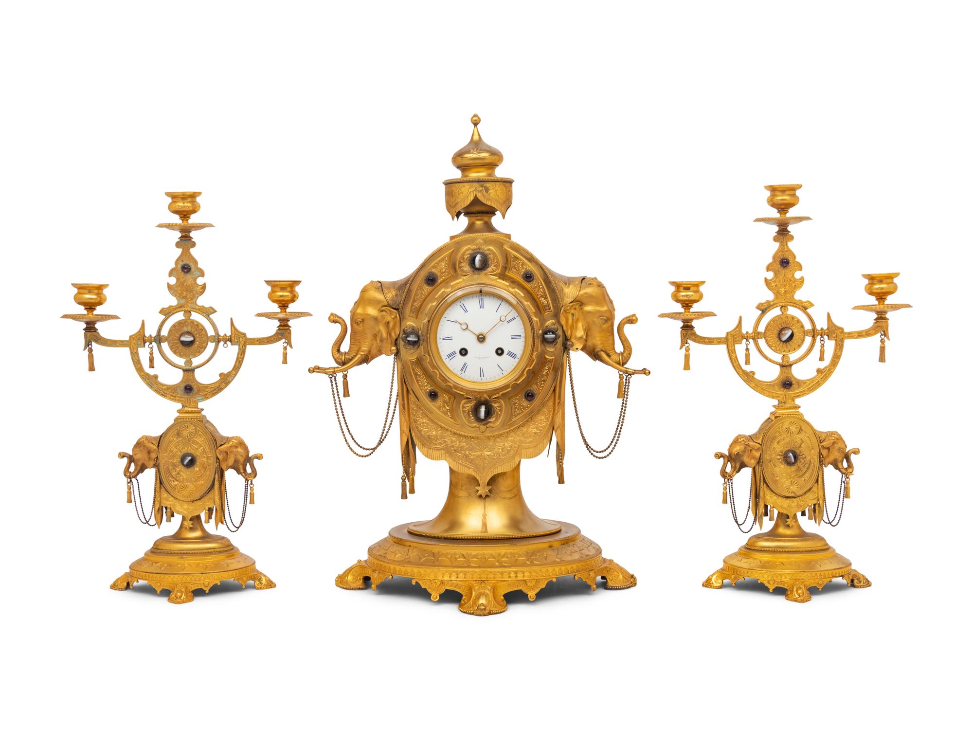 An English Orientalist Gilt Bronze Three-Piece Clock Garniture