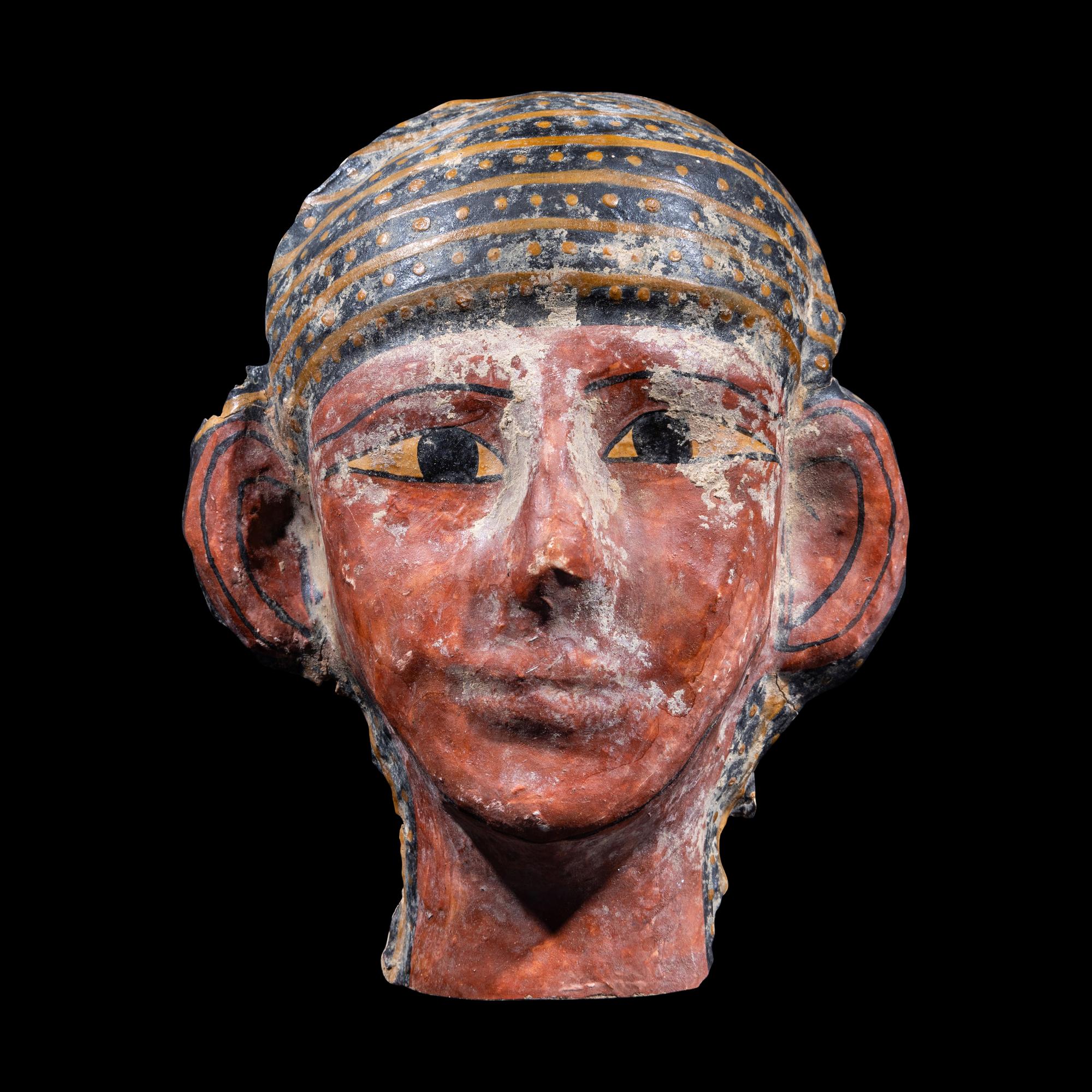 An Egyptian Cartonnage Mummy Mask