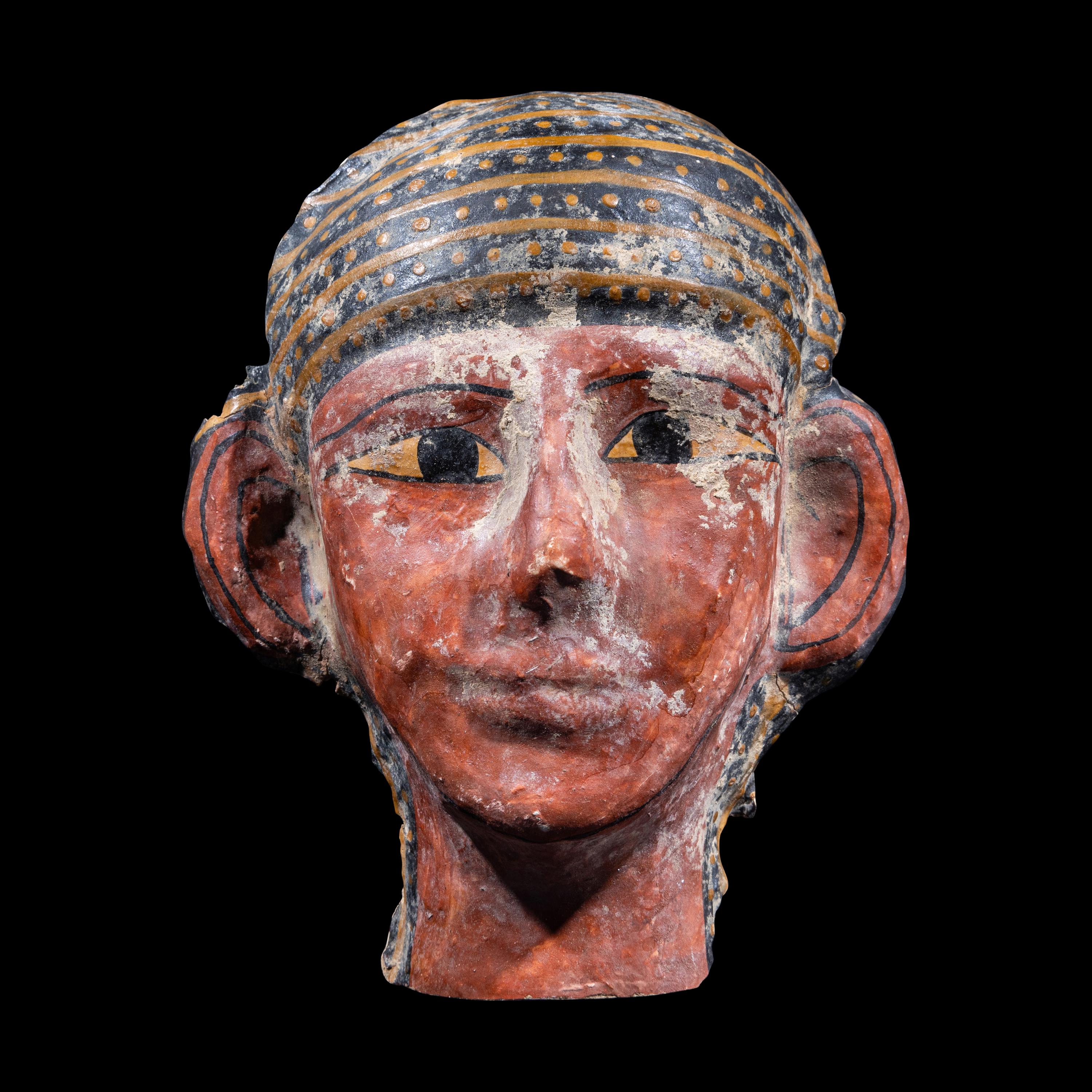 An Egyptian Cartonnage Mummy Mask