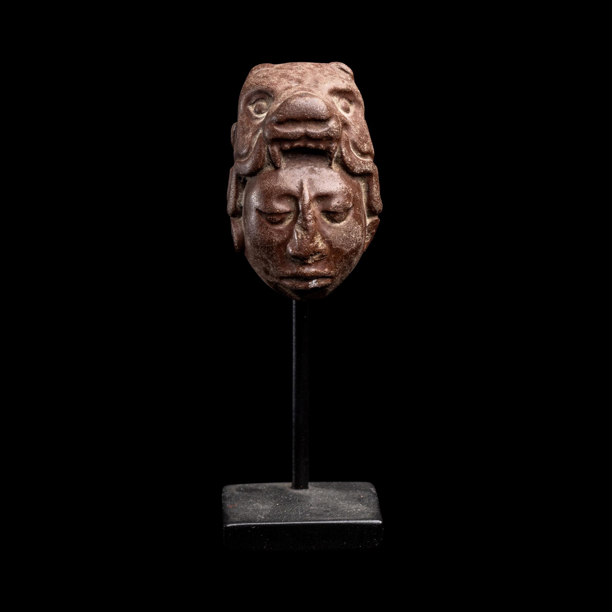 A Maya Stone Head Pendant