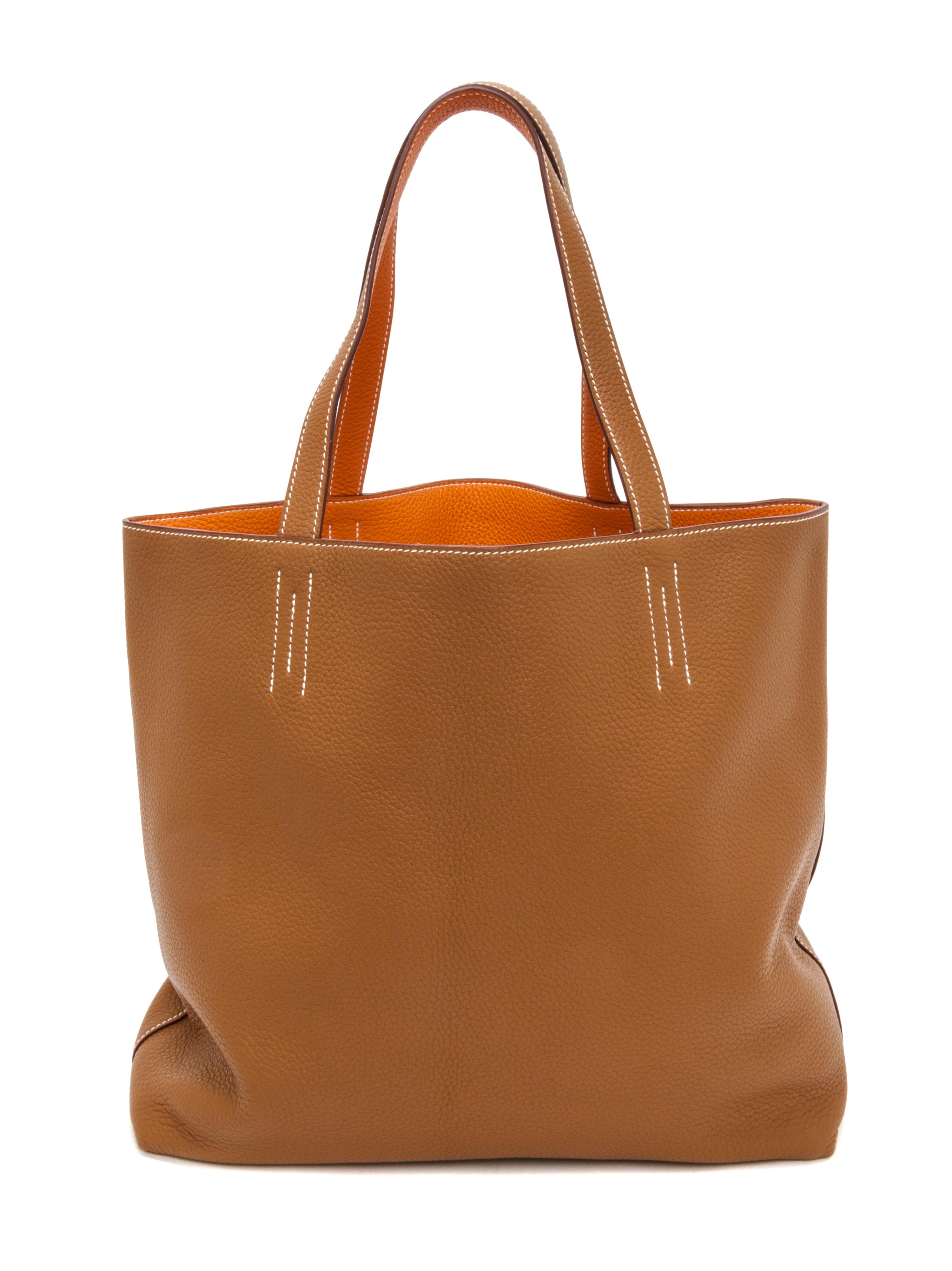 An Hermes Orange/Gold 45cm Taurillon Clemence Double Sens Tote, 17.5" x 15.5" x 5".