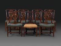 A Set of Six Chippendale Style Carved Mahogany Dining Chairs