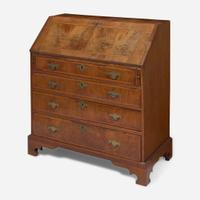 A Queen Anne walnut-banded and pine slant-front desk circa 1740
