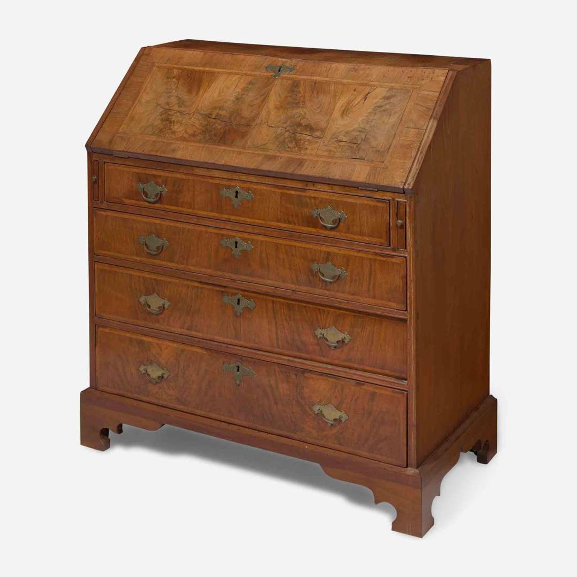 A Queen Anne walnut-banded and pine slant-front desk circa 1740