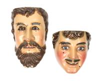 Two Mexican Polychromed Wood and Glass Masks Height 10 inches.