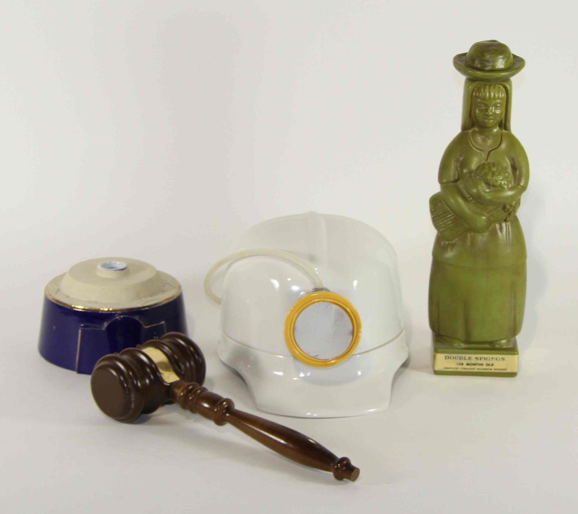 A Group of Nine Haeger Pottery Liquor Bottles Height of tallest 13 1/2 inches.