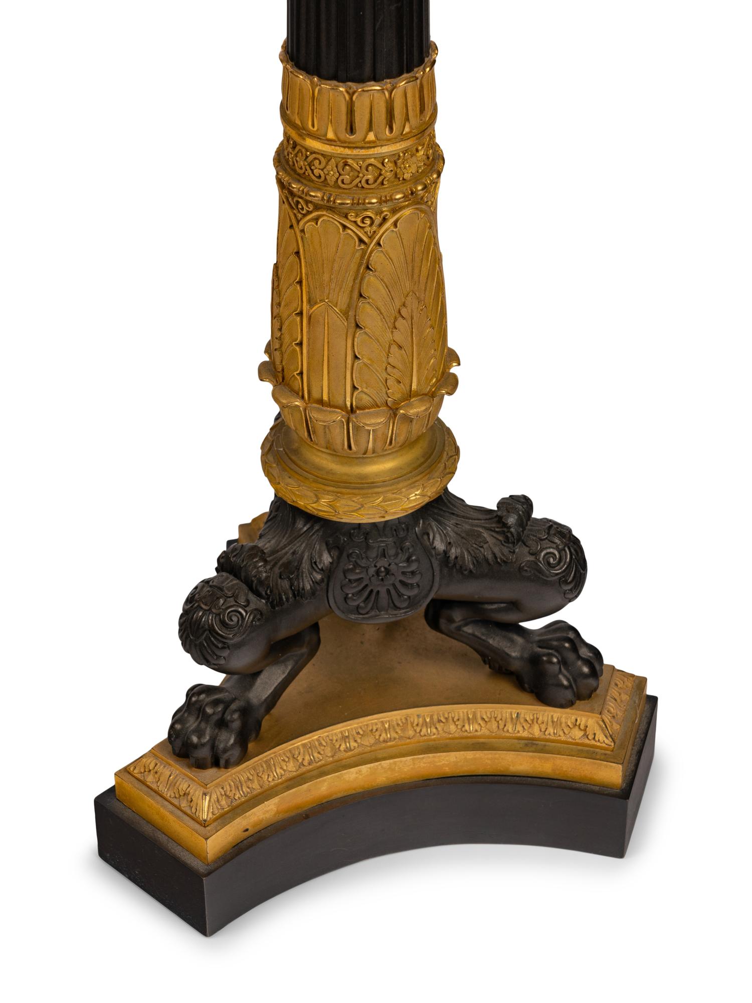 A Pair of Large Empire Style Gilt and Patinated Bronze Five-Light Candelabra