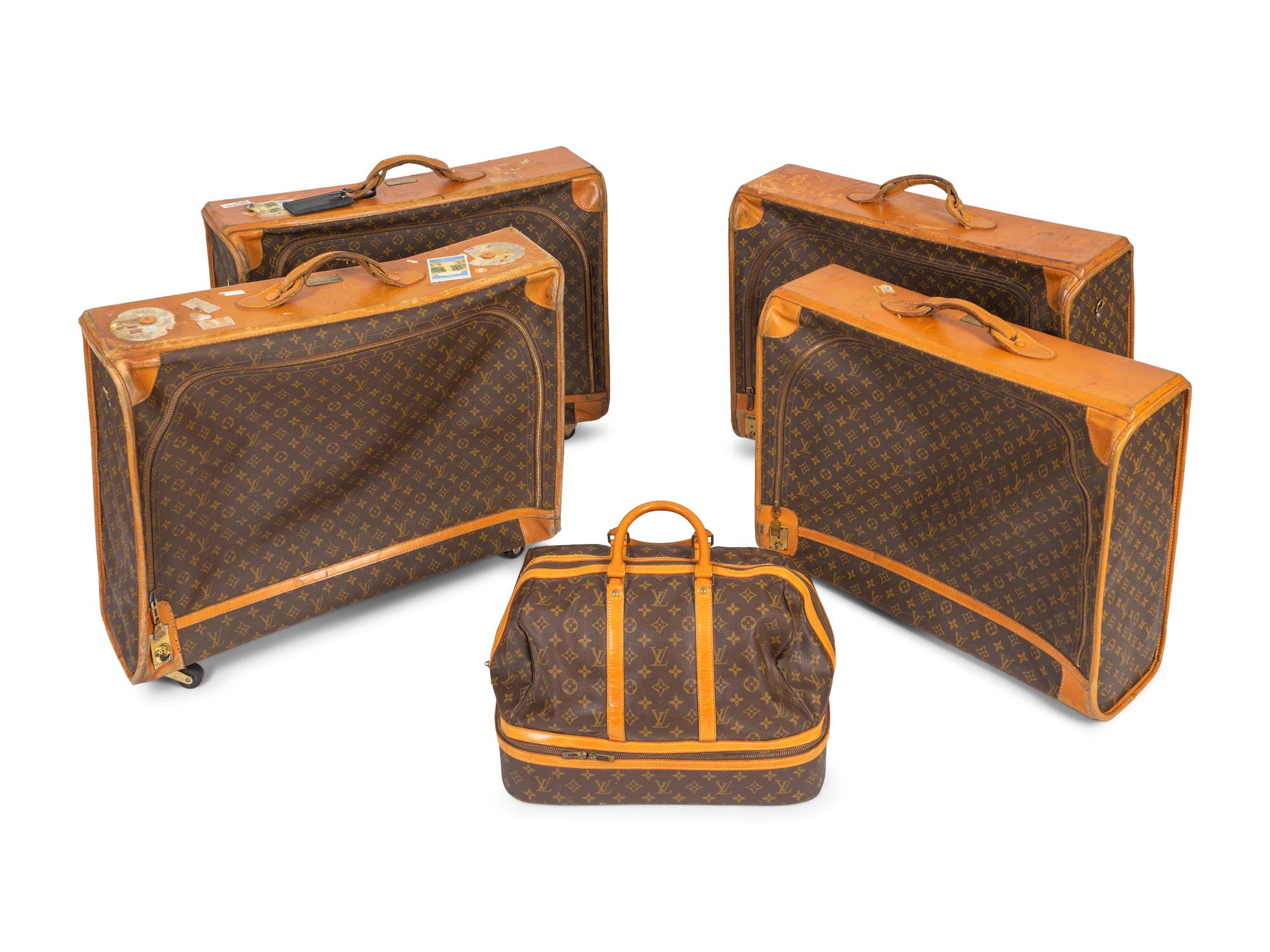 Five Louis Vuitton Suitcases