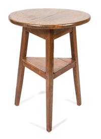 An English Stripped Pine Cricket Table Height 28 1/2 x diameter 21 3/4 inches. — 20TH CENTURY
