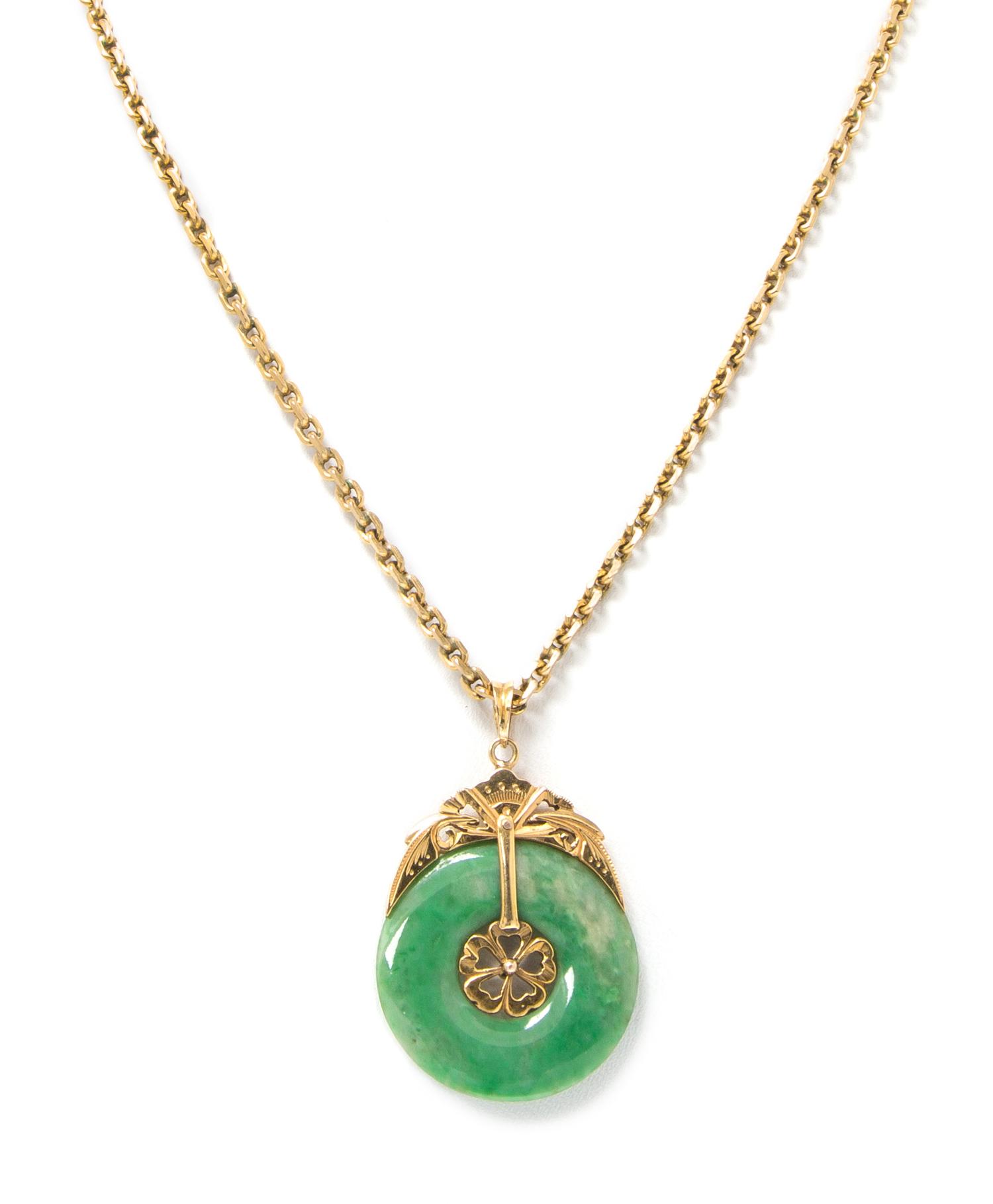 A 14 Karat Yellow Gold and Jade Pendant Necklace, 8.60 dwts.