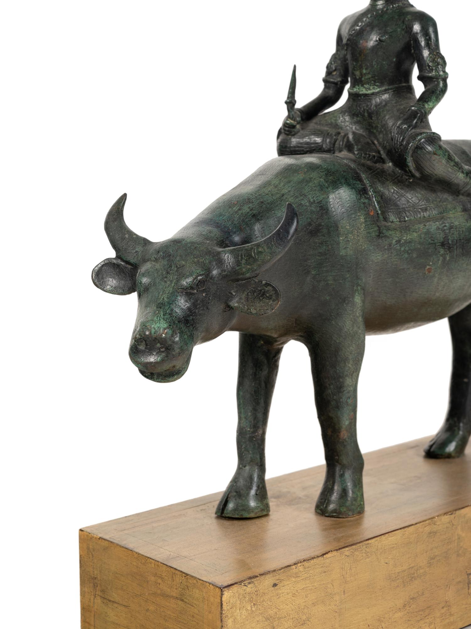 An Indian or Southeast Asian Bronze Model of a Figure on a Water Buffalo