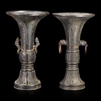 Two patinated bronze archaistic gu-form vases 18th/19th century or earlier