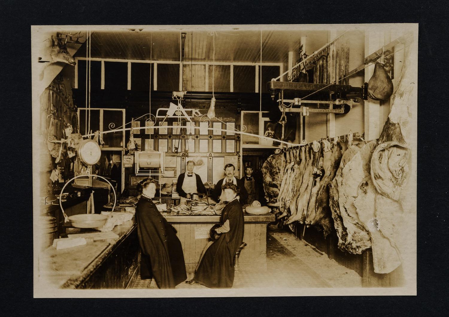 Nine Photographs Depicting Storefronts and Various Interiors