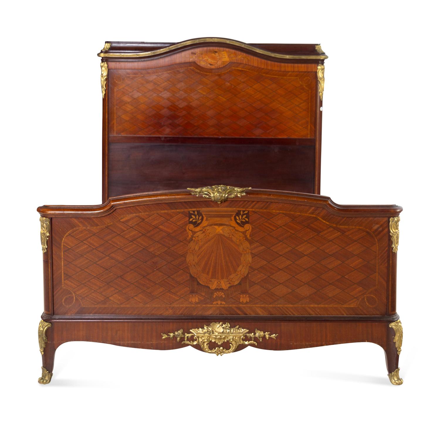 A Louis XV/XVI Transitional Style Gilt Bronze Mounted Marquetry and Parquetry Bed