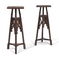 A Pair of Neogothic Carved Oak Jardiniere Stands