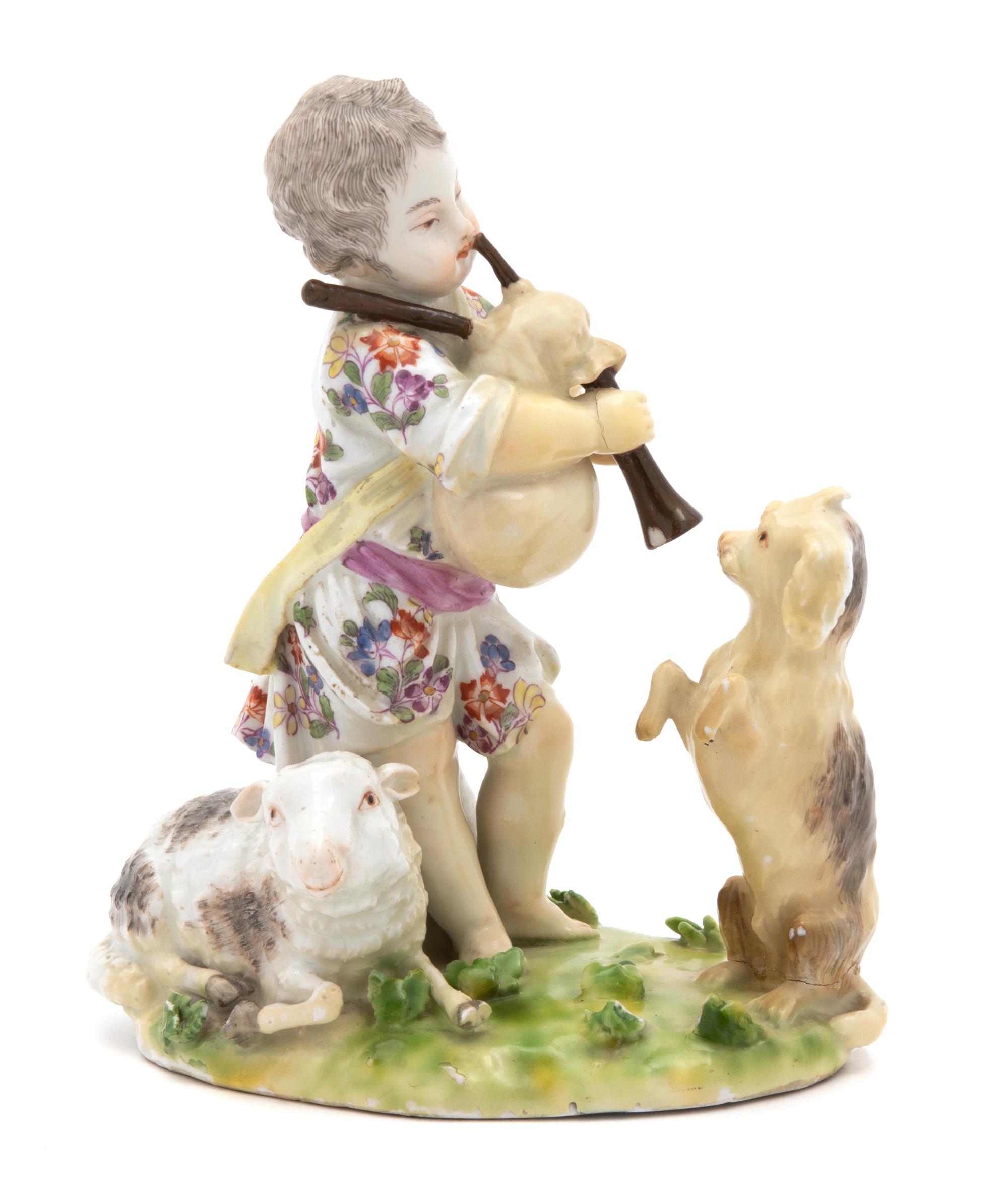 A Meissen Figure of a Putto with Bagpipes Watched by a Dog Height 5 1/2 inches. — 18TH CENTURY