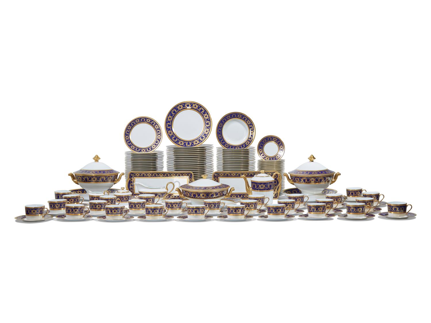 A Tharaud- Limoges Parcel Gilt and Cobalt Decorated Porcelain Dinner Service