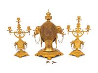 An English Orientalist Gilt Bronze Three-Piece Clock Garniture