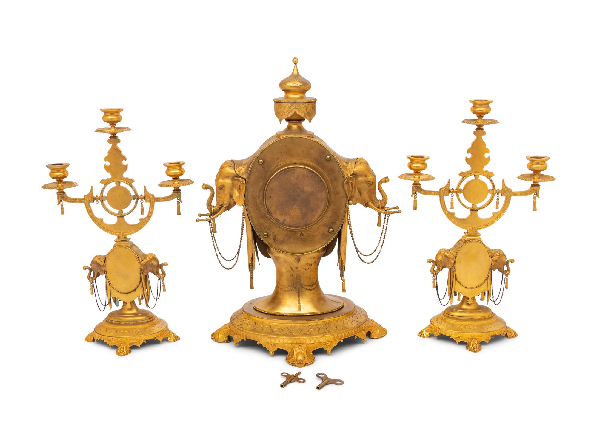 An English Orientalist Gilt Bronze Three-Piece Clock Garniture