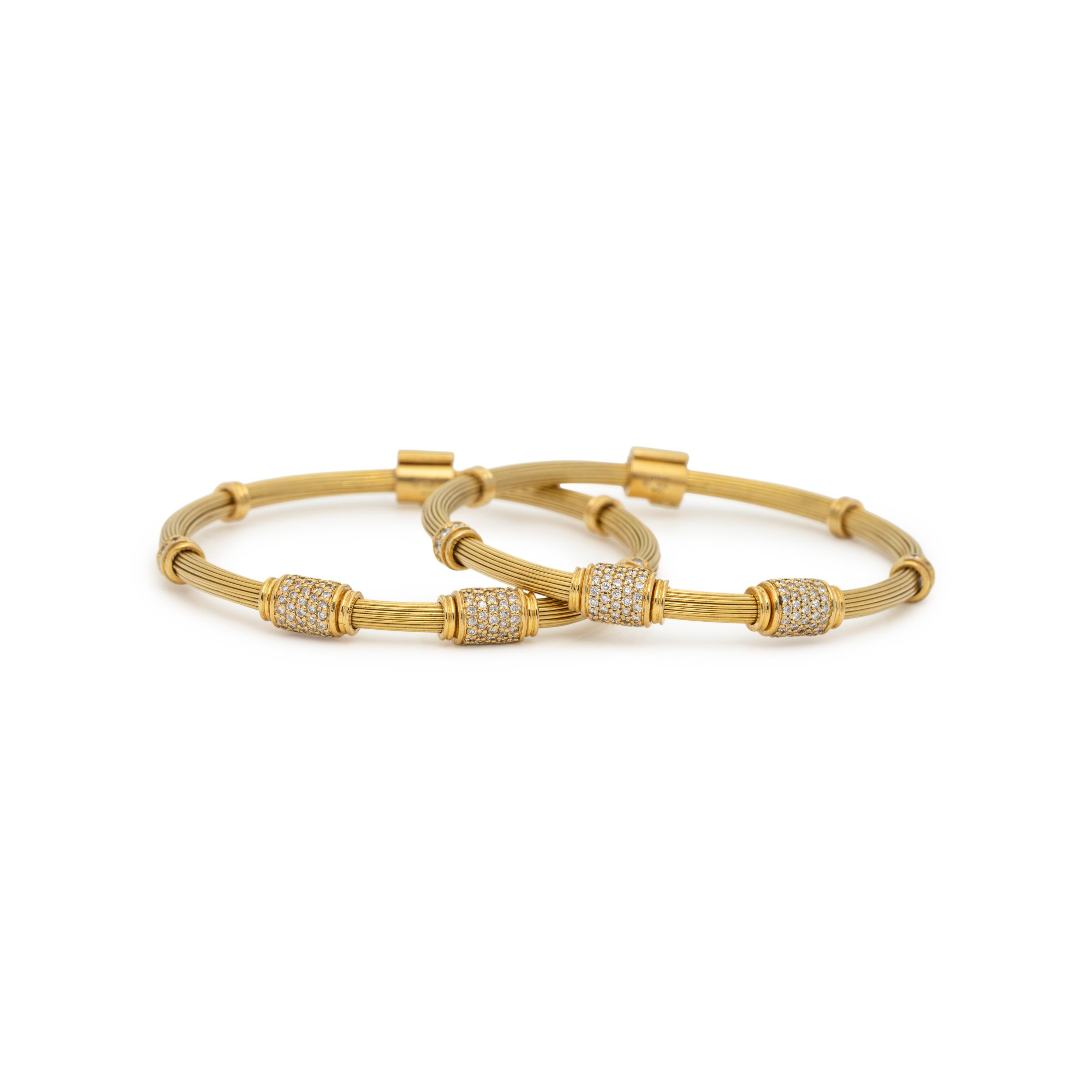 PAIR OF YELLOW GOLD AND DIAMOND BANGLE BRACELETS