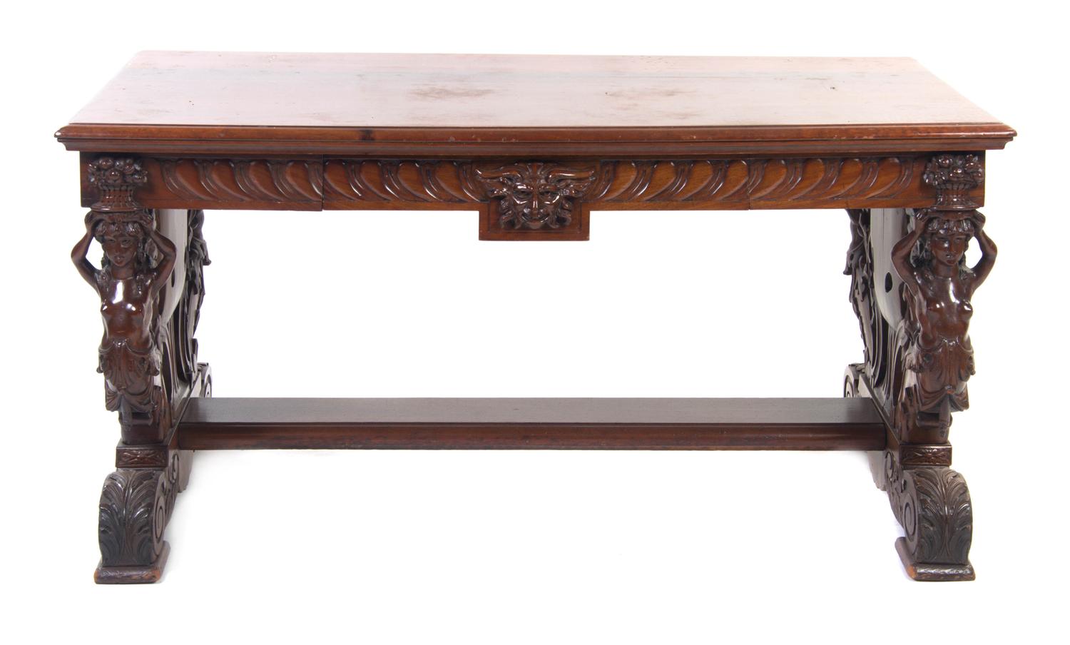 A Renaissance Revival Mahogany Library Table, Height 29 x width 59 1/4 x depth 31 3/4 inches.