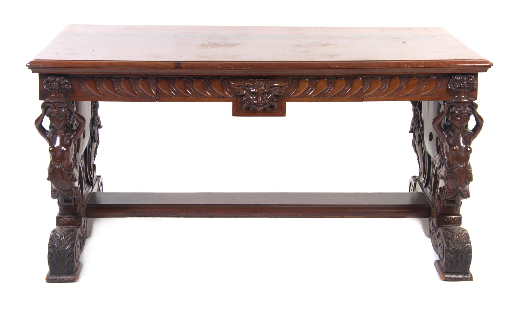 A Renaissance Revival Mahogany Library Table, Height 29 x width 59 1/4 x depth 31 3/4 inches.