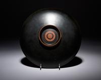 An Apulian Red-Figured Plate with Striding Eros