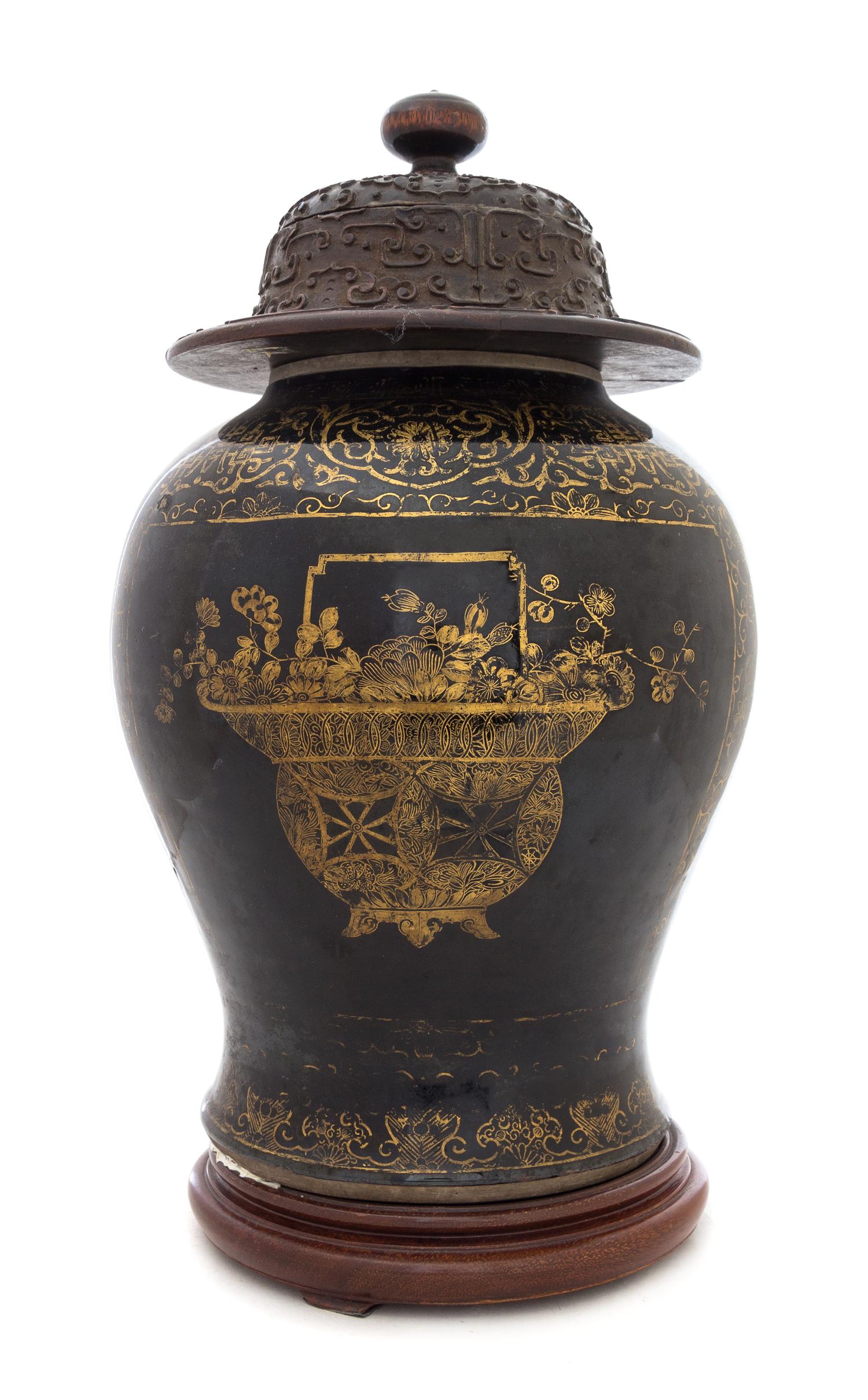 A Gilt Decorated Mirror Black Glazed Porcelain Baluster Jar Height 12 inches.