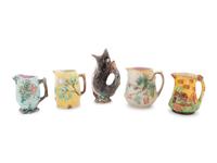 A Group of Nine Majolica Pitchers
