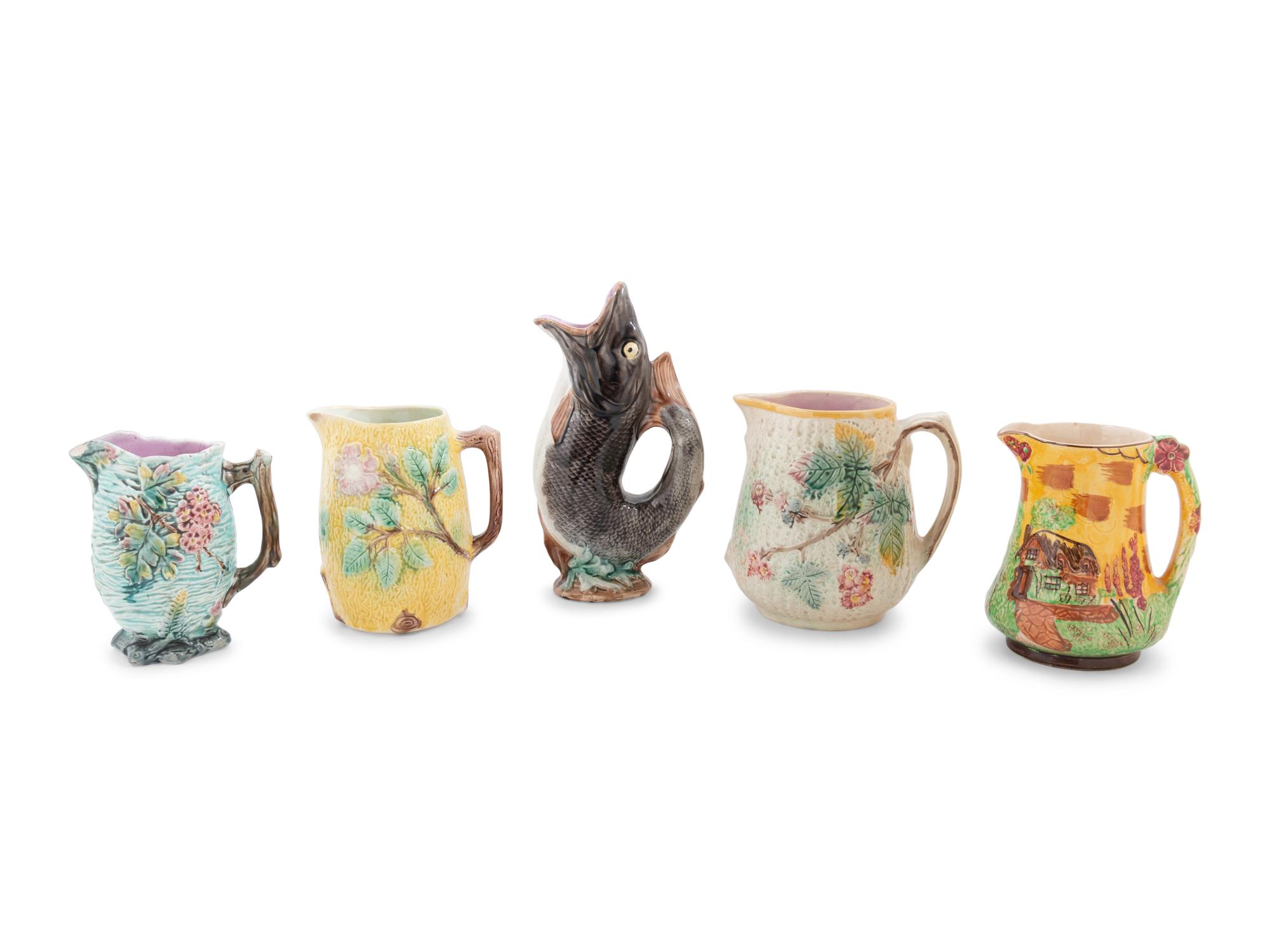 A Group of Nine Majolica Pitchers