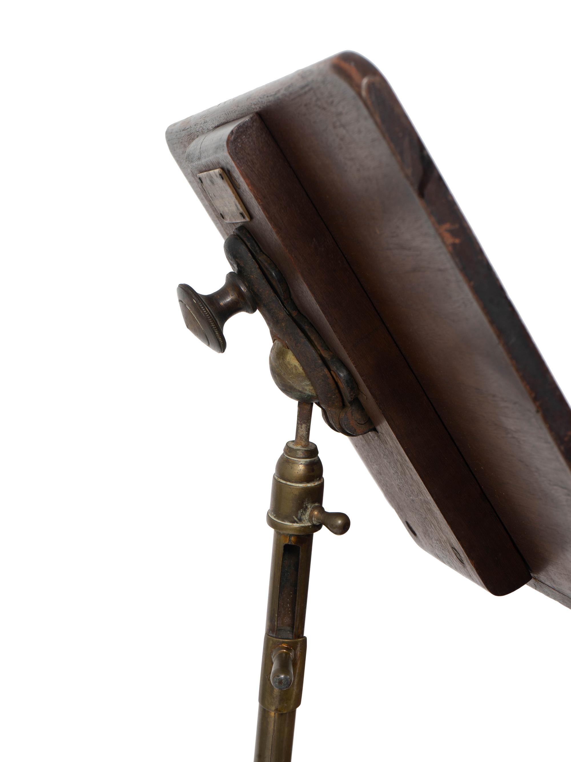 An English Mahogany and Brass Table with Adjustable Book Shelf — 19TH/20TH CENTURY
