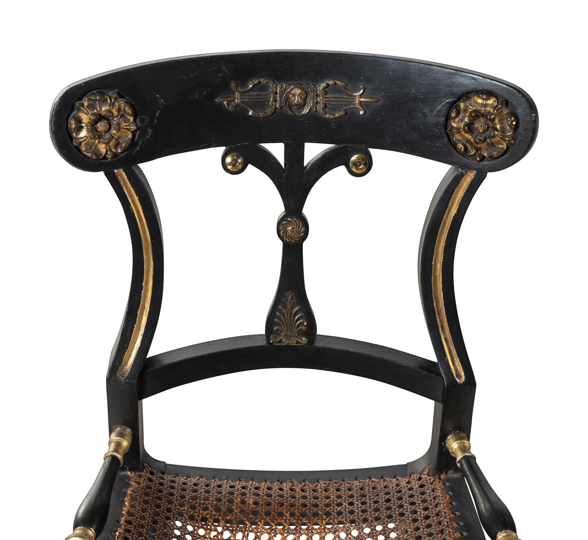 A Pair of Regency Dark Green-Painted and Parcel Gilt Side Chairs