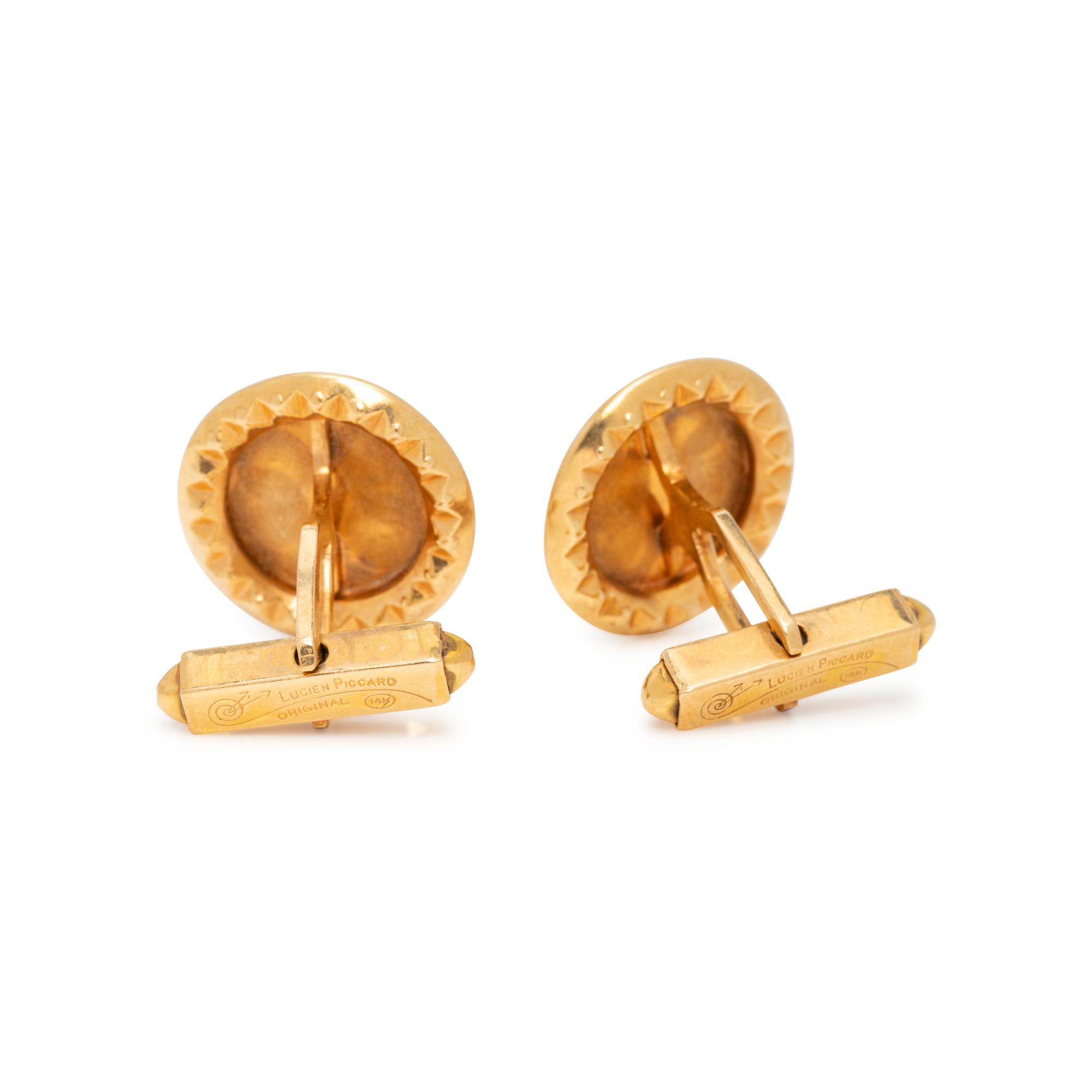 LUCIEN PICCARD, YELLOW GOLD AND RUBY CUFFLINKS