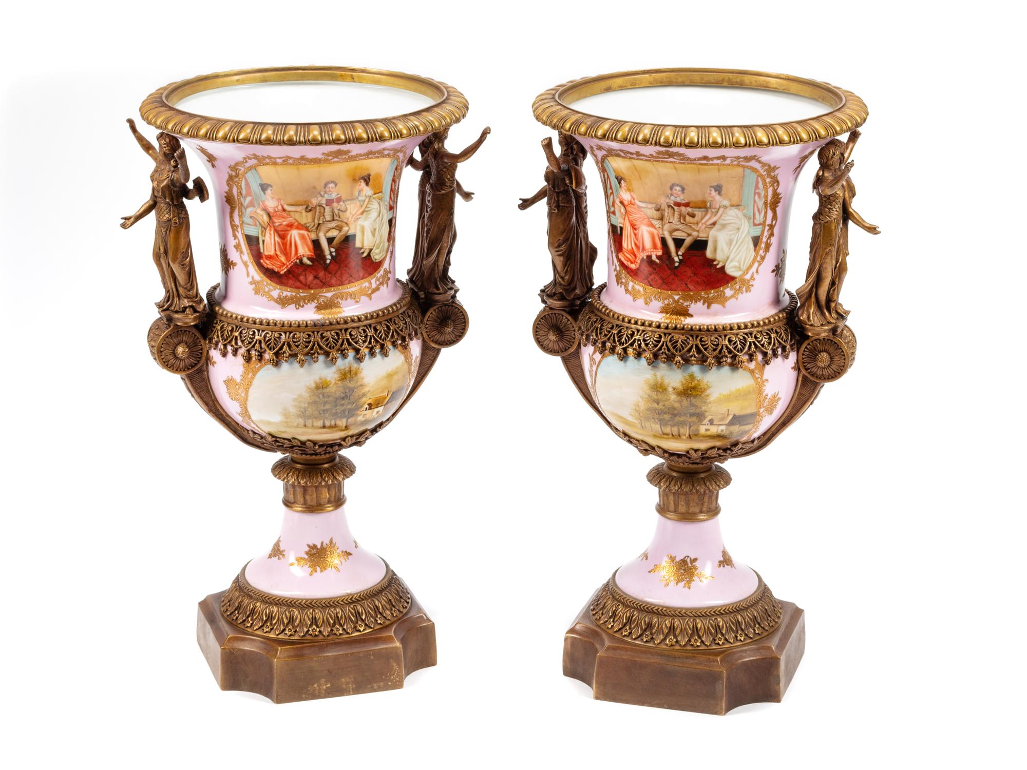 A Pair of Sèvres Style Gilt Bronze Mounted Porcelain Urns