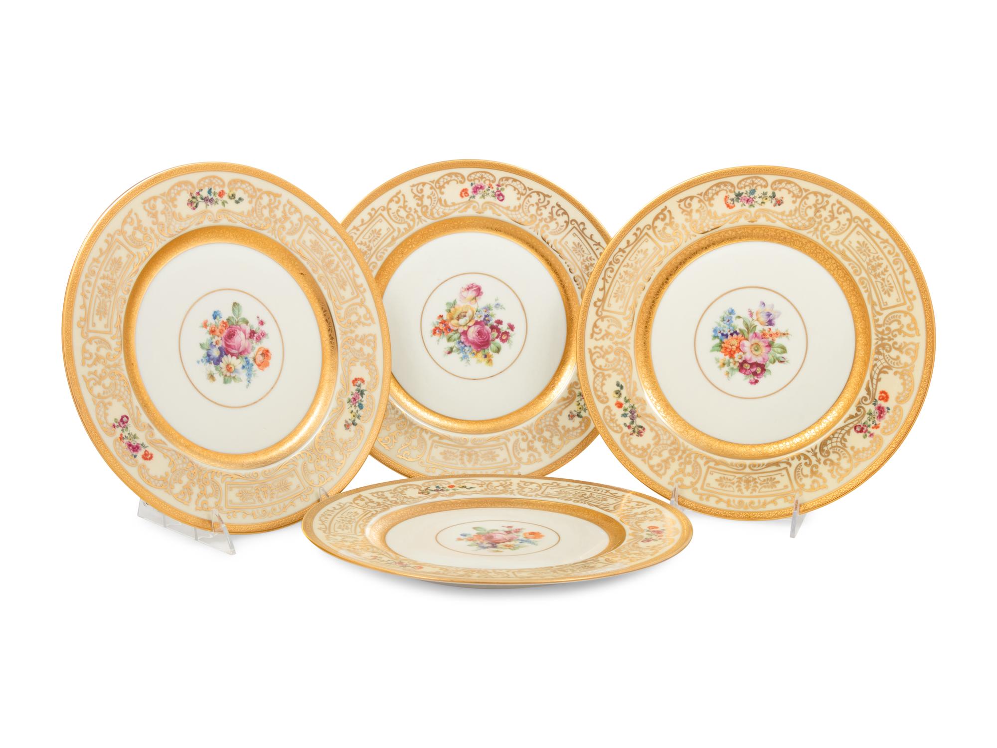A Set of Eight Bavarian Parcel Gilt Porcelain Dinner Plates