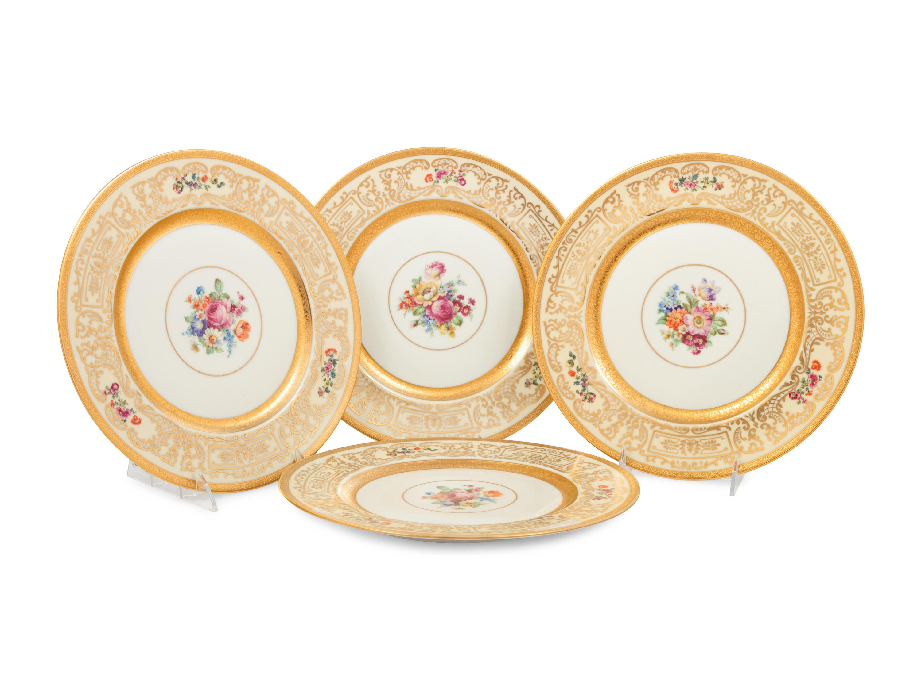 A Set of Eight Bavarian Parcel Gilt Porcelain Dinner Plates