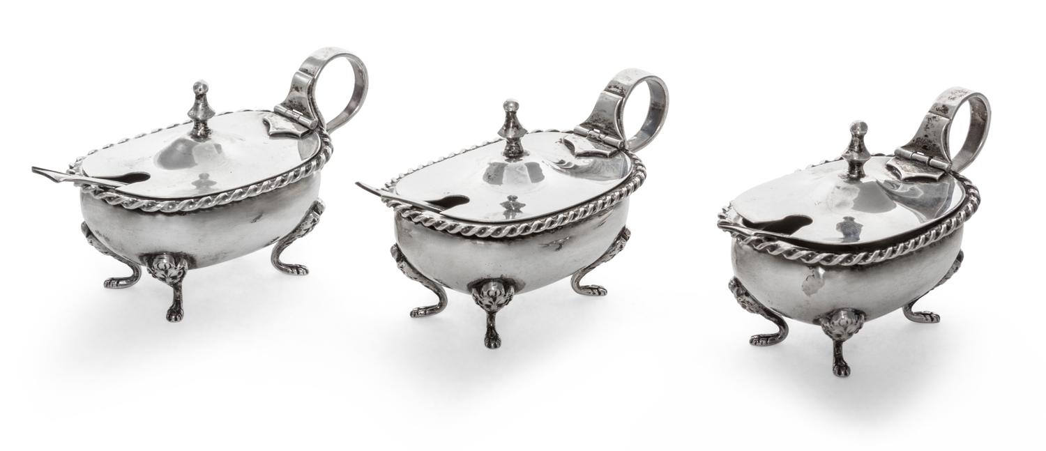A Set of Three Italian Silver Salts, 19th/20th Century, oval with twisted rims and raised on four paw supports, scroll handles, with th