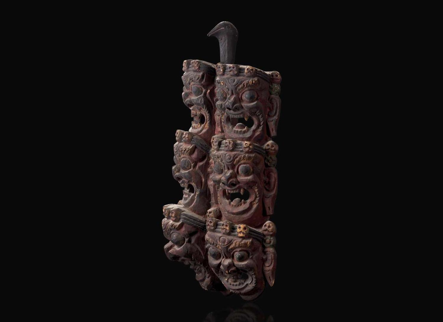 A Nepalese carved and polychromed wood mask 尼泊爾加彩木面具