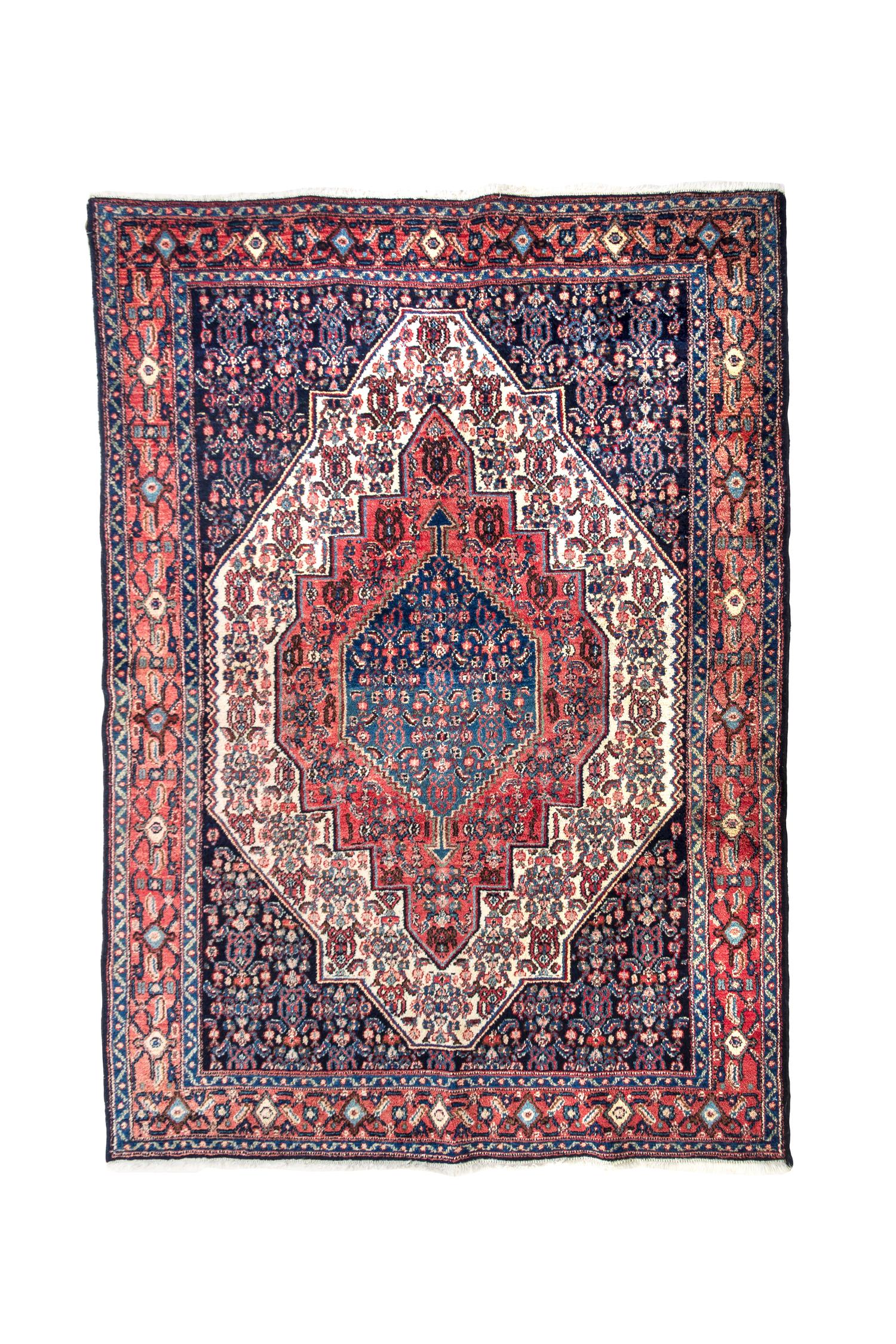 A Heriz Wool Mat 5 feet 3 inches x 3 feet 11 inches.