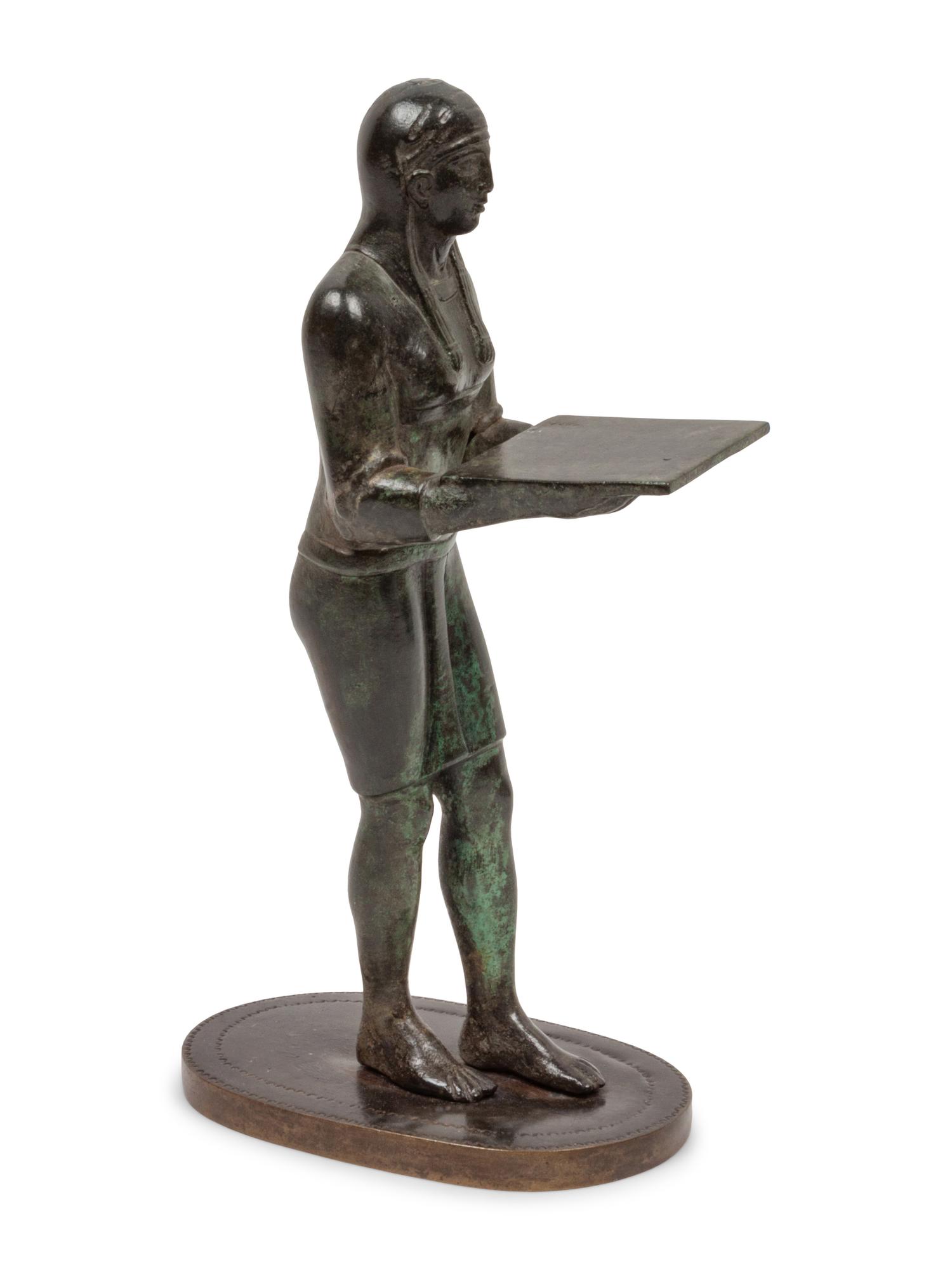 A Patinated Bronze Figure of an Egyptian as an Offering-Bearer