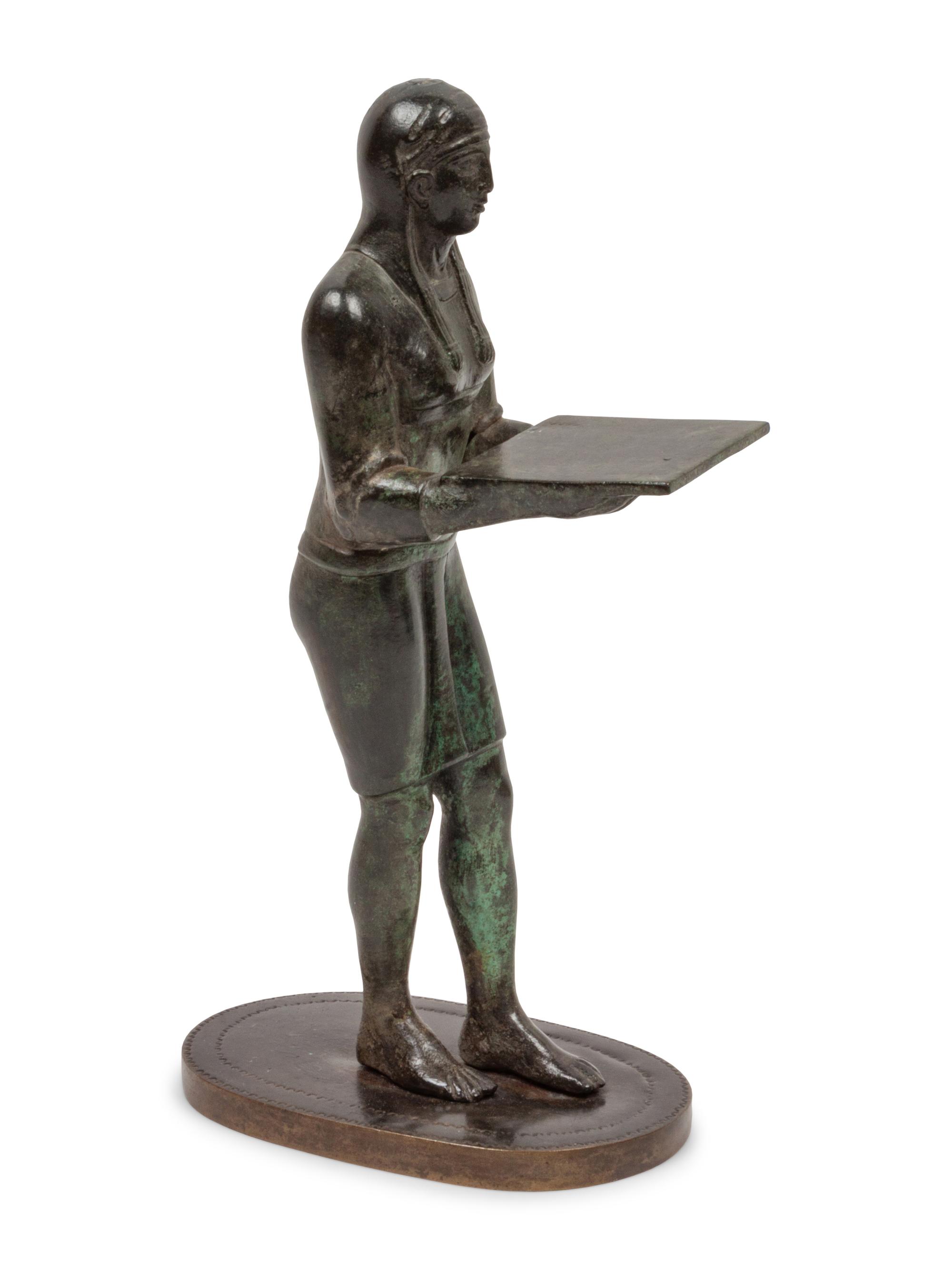 A Patinated Bronze Figure of an Egyptian as an Offering-Bearer