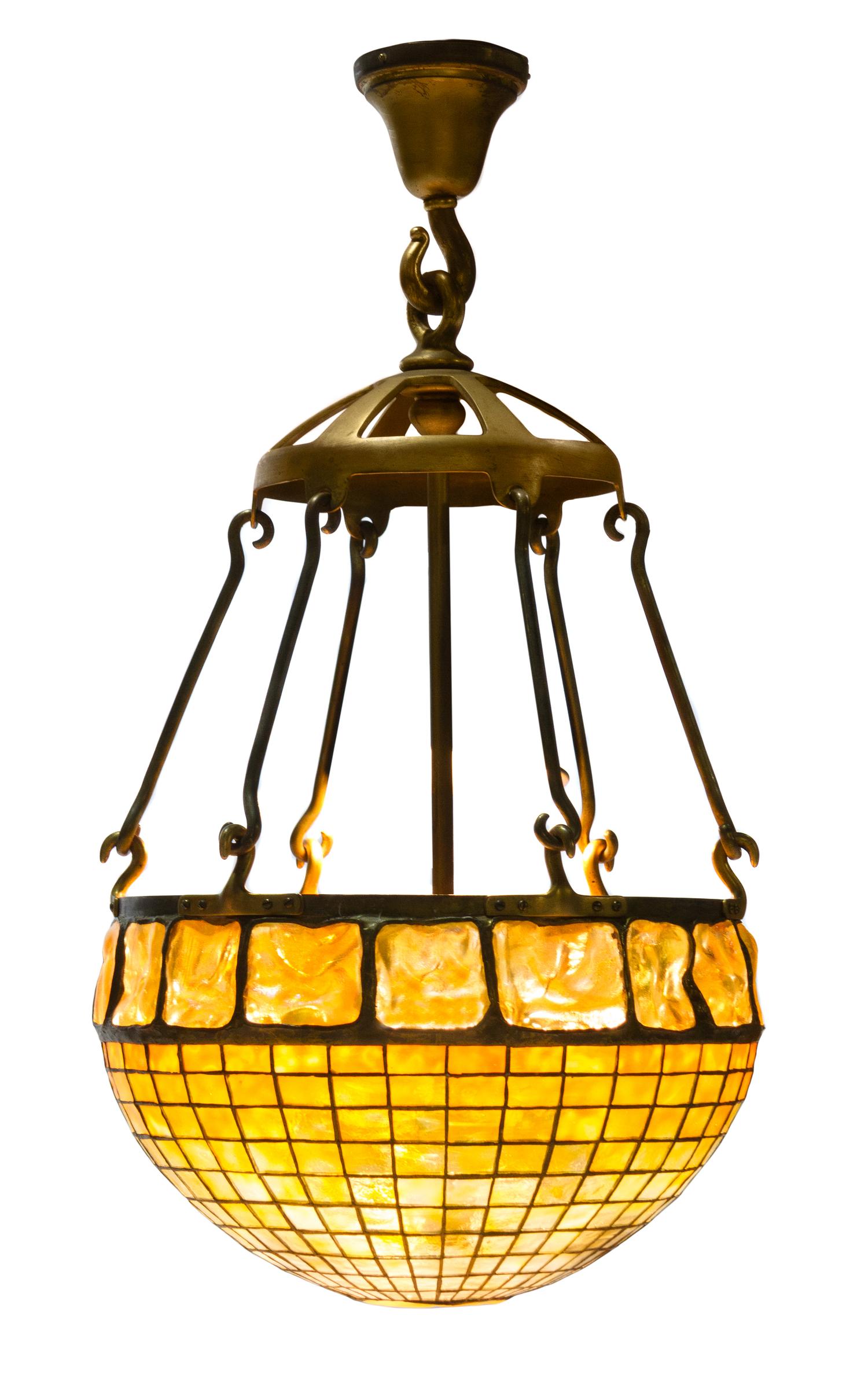 A Tiffany Studios Favrile Glass and Gilt Bronze Geometric Chandelier Diameter of shade 16 inches.